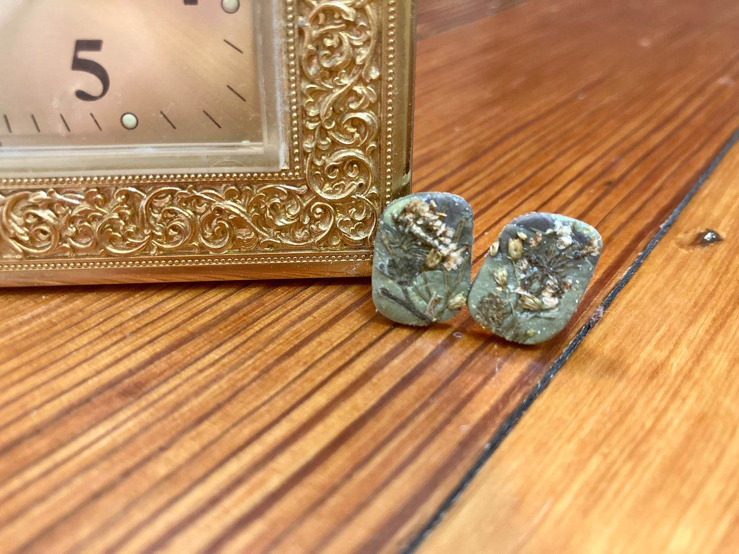 Green floral studs